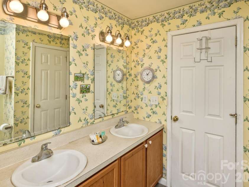 11 Dusty Lane, Leicester, NC 28748.  MLS# CAR4412609, YatesRealty ID 42377. PRIMARY BATH W/NEWER WALK IN SHOWER