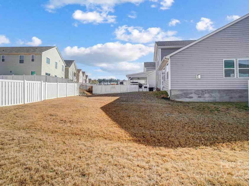 19117 Hawk Haven Lane, Charlotte, NC 28278.  MLS# CAR4215357, YatesRealty ID 4238. Backyard side view