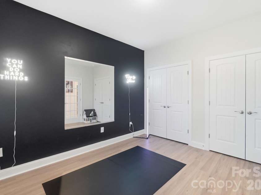 193 Adams Tree Way, Troutman, NC 28166.  MLS# CAR4405517, YatesRealty ID 42384. Downstairs flex space with doors and closets