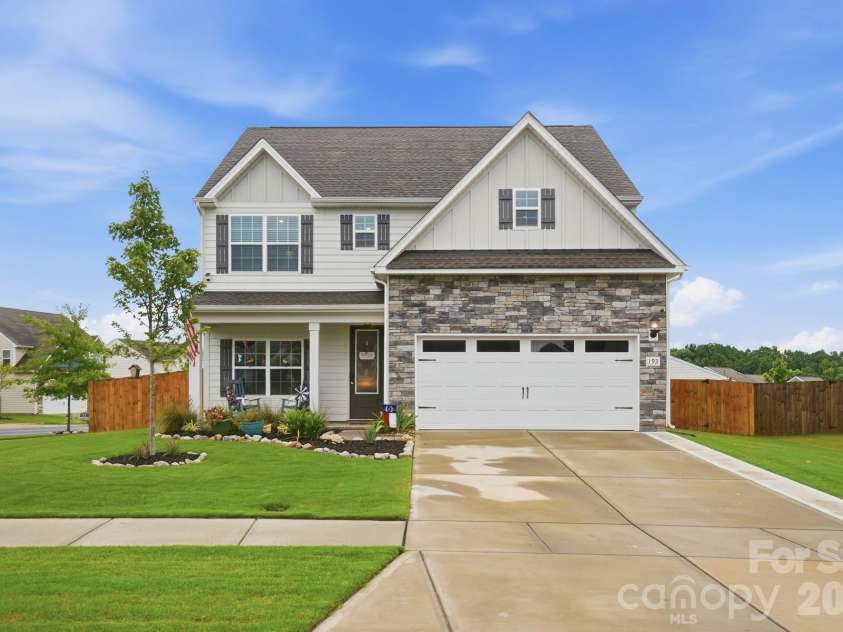 193 Adams Tree Way, Troutman, NC 28166.  MLS# CAR4405517, YatesRealty ID 42384. Front of home with widened driveway