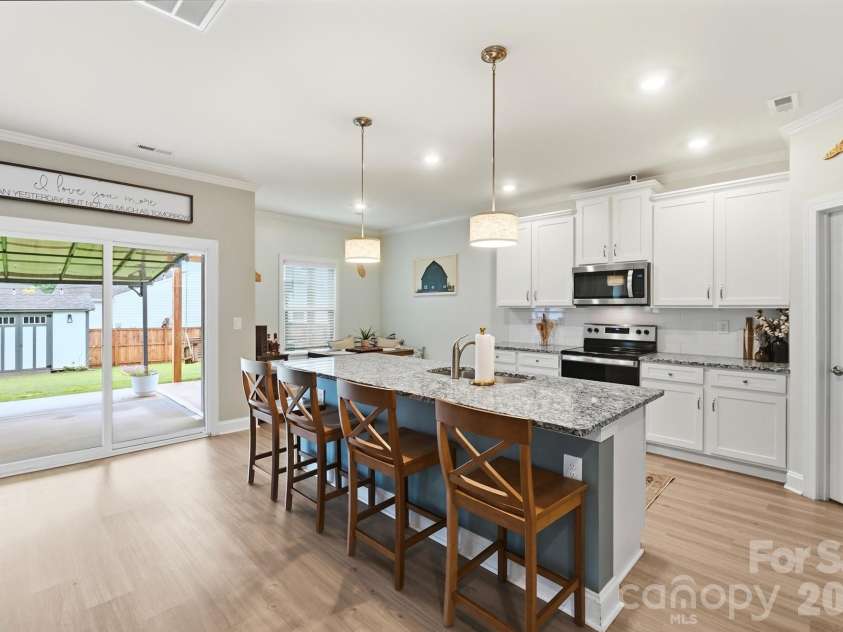193 Adams Tree Way, Troutman, NC 28166.  MLS# CAR4405517, YatesRealty ID 42384. Kitchen with access to outdoor living space