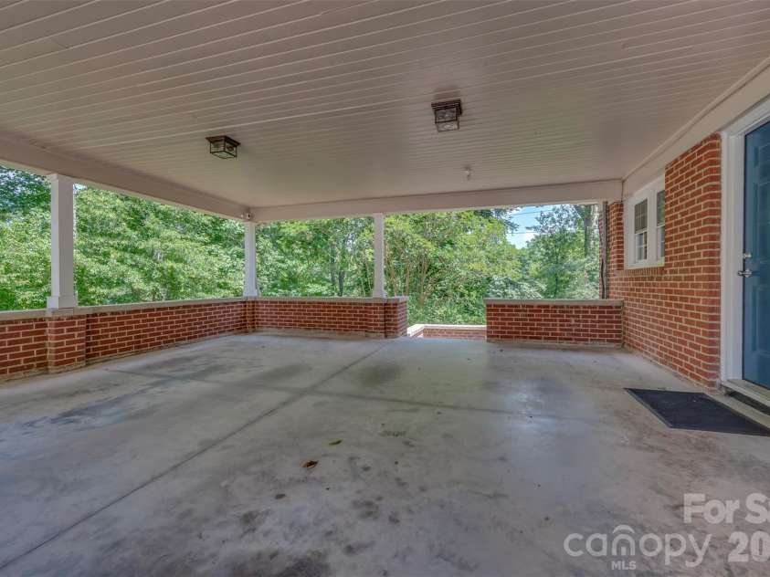 303 Elizabeth Avenue, Forest City, NC 28043.  MLS# CAR4398405, YatesRealty ID 42409. Double Carport