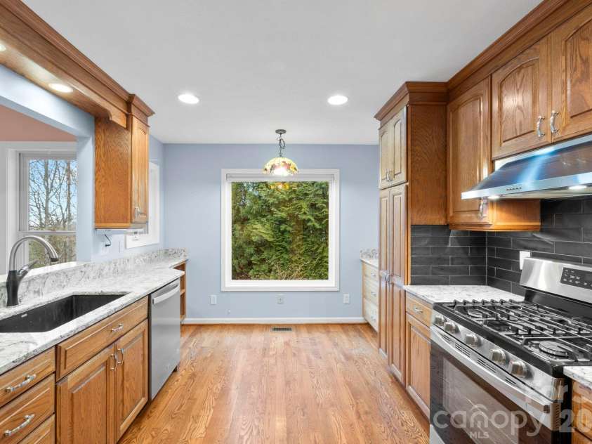 242 Carriage Summitt Way, Hendersonville, NC 28791.  MLS# CAR4335765, YatesRealty ID 42411. Kitchen opens to great room