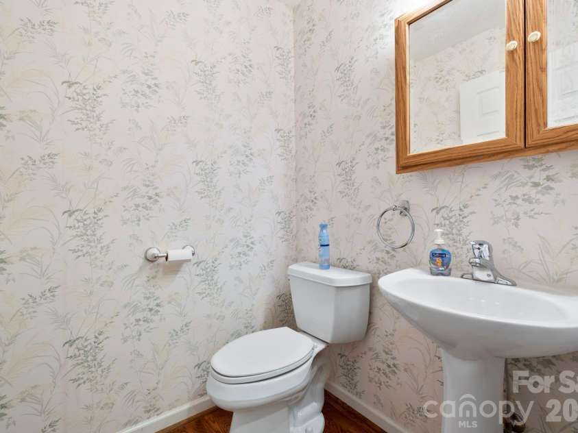 242 Carriage Summitt Way, Hendersonville, NC 28791.  MLS# CAR4335765, YatesRealty ID 42411. Powder room on main level