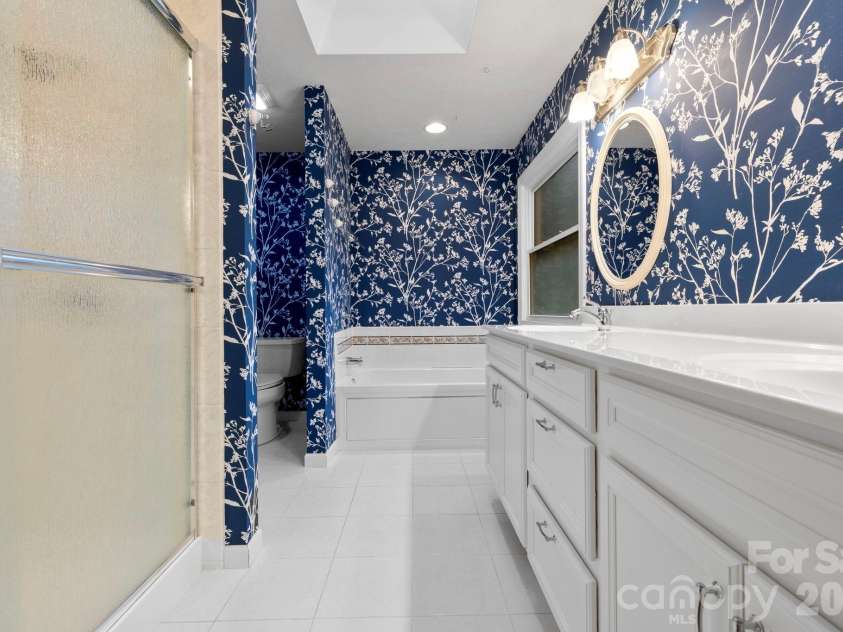 242 Carriage Summitt Way, Hendersonville, NC 28791.  MLS# CAR4335765, YatesRealty ID 42411. Primary ensuite bath with double sinks