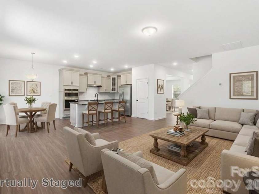 2621 Wild Azalea Court, Monroe, NC 28110.  MLS# CAR4378939, YatesRealty ID 42412. Family Room- Virtually Staged