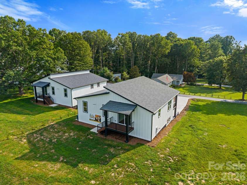 27 Klimovych Road, Hendersonville, NC 28792.  MLS# CAR4399870, YatesRealty ID 42413. Back of the house and back yard