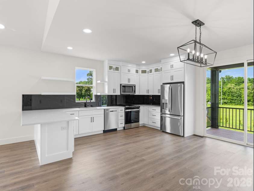 27 Klimovych Road, Hendersonville, NC 28792.  MLS# CAR4399870, YatesRealty ID 42413. Kitchen And Dining room