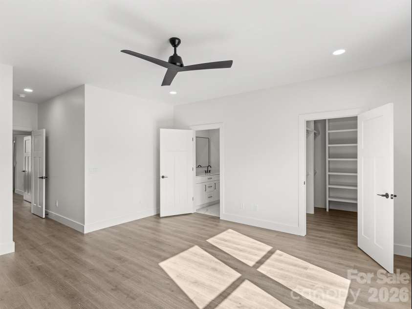 27 Klimovych Road, Hendersonville, NC 28792.  MLS# CAR4399870, YatesRealty ID 42413. Primary ensuite and walk-in closet