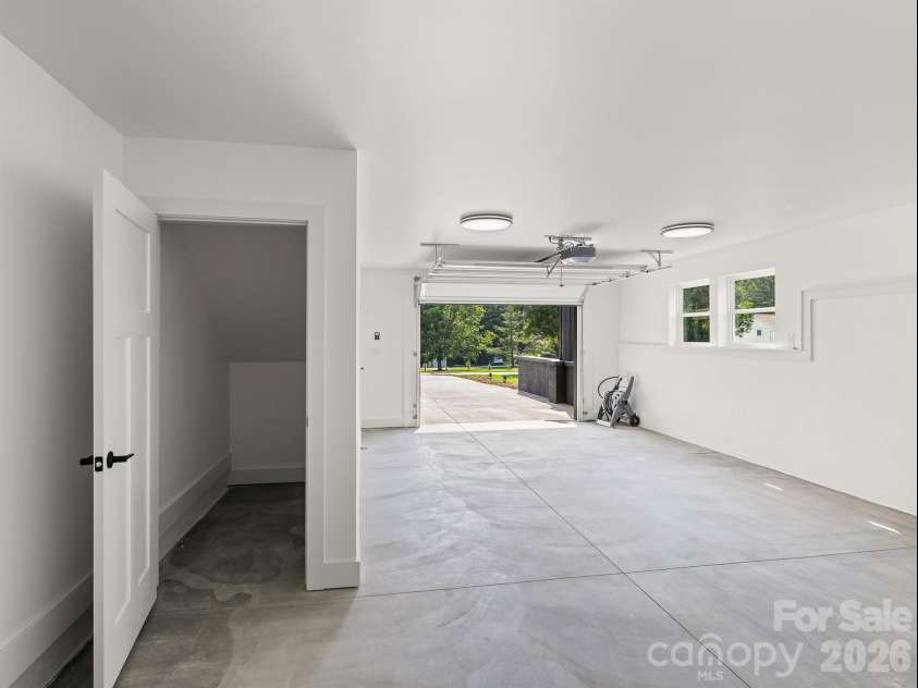 27 Klimovych Road, Hendersonville, NC 28792.  MLS# CAR4399870, YatesRealty ID 42413. Storage under stairs