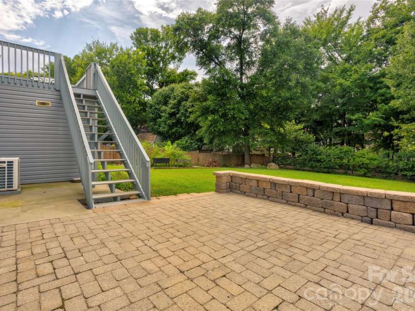 4735 Asherton Place, Concord, NC 28027.  MLS# CAR4409541, YatesRealty ID 42427. Backyard lower patio