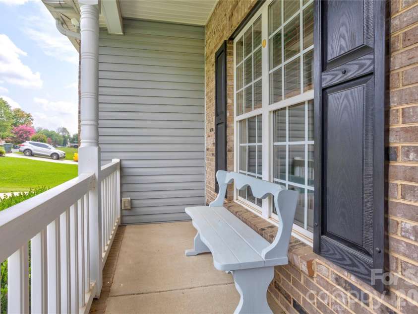 4735 Asherton Place, Concord, NC 28027.  MLS# CAR4409541, YatesRealty ID 42427. Covered front porch