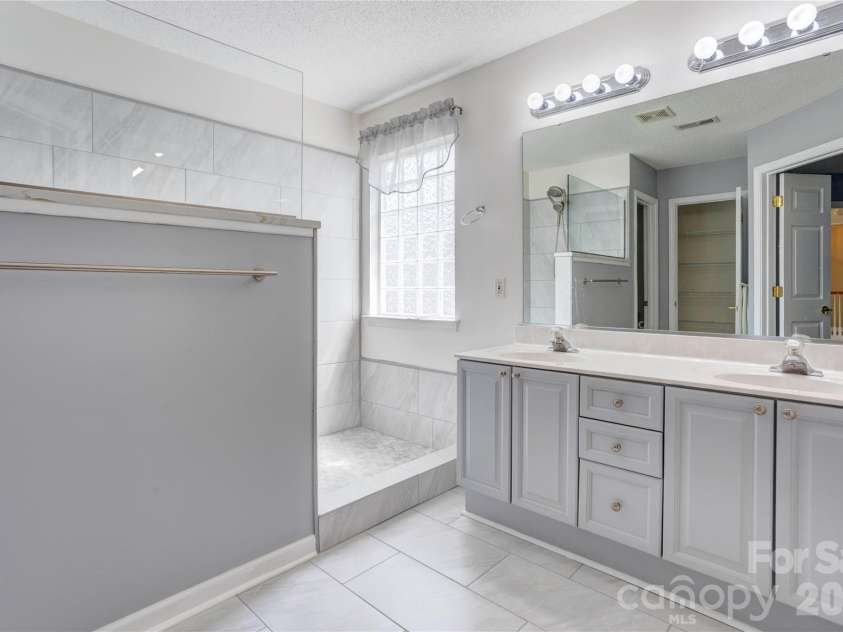 4735 Asherton Place, Concord, NC 28027.  MLS# CAR4409541, YatesRealty ID 42427. Primary bathroom