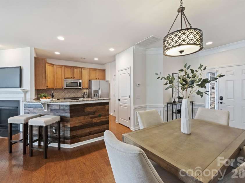 6408 Silver Star Lane, Charlotte, NC 28210.  MLS# CAR4395408, YatesRealty ID 42430. Breakfast bar with wood accent wall