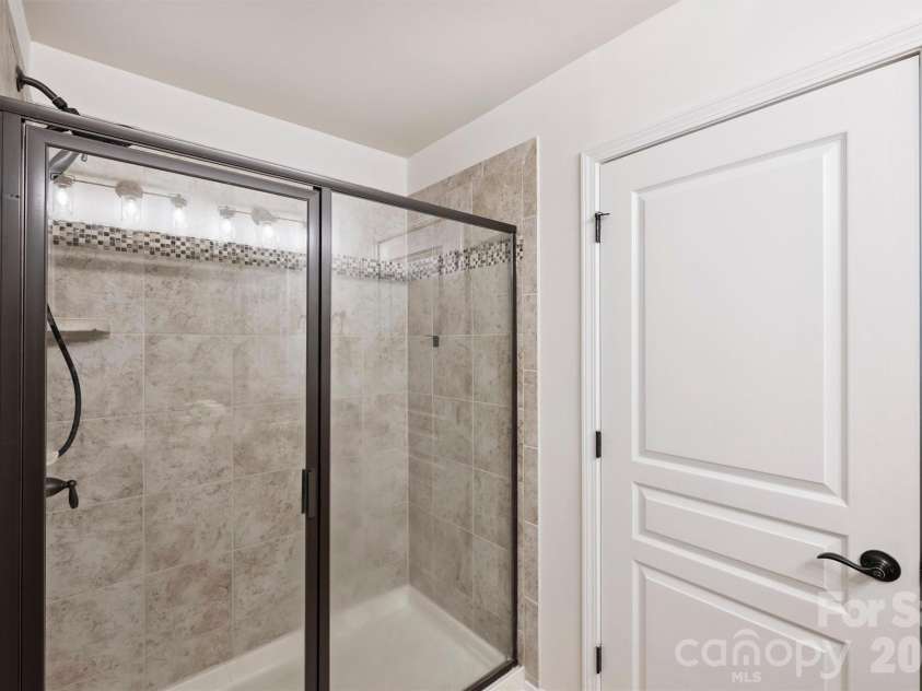 6408 Silver Star Lane, Charlotte, NC 28210.  MLS# CAR4395408, YatesRealty ID 42430. Shower in Primary Bath