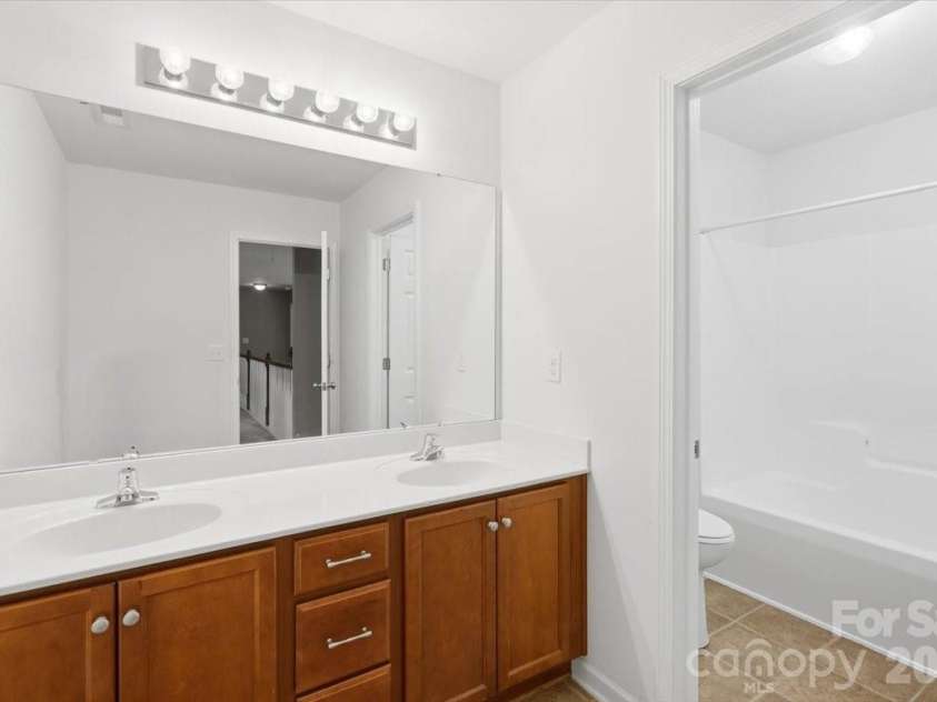 5307 Hackberry Lane, Concord, NC 28027.  MLS# CAR4409364, YatesRealty ID 42445. 2nd Floor Bathroom