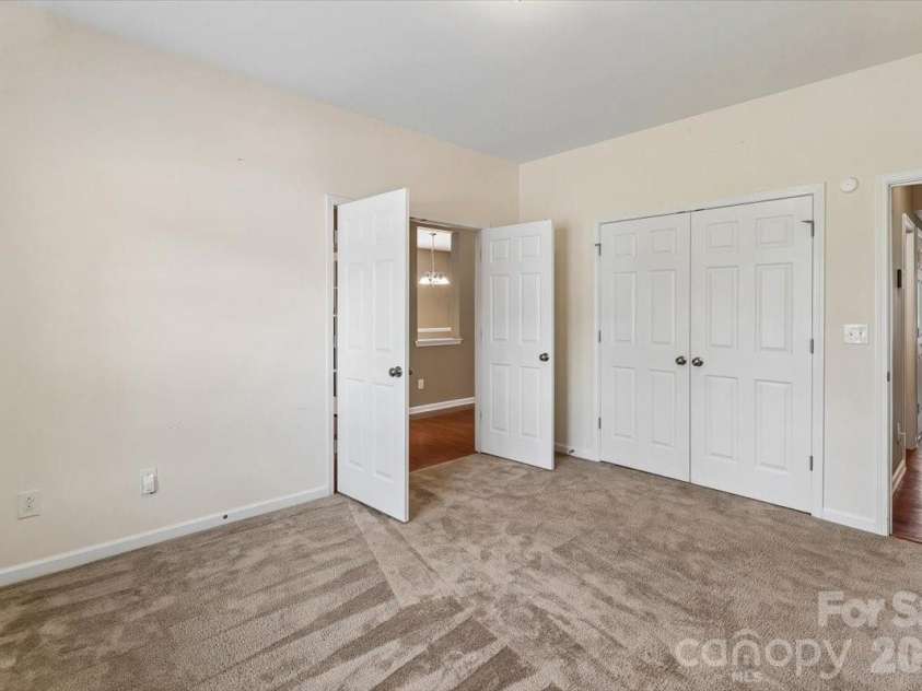 5307 Hackberry Lane, Concord, NC 28027.  MLS# CAR4409364, YatesRealty ID 42445. First Floor Secondary Bedroom