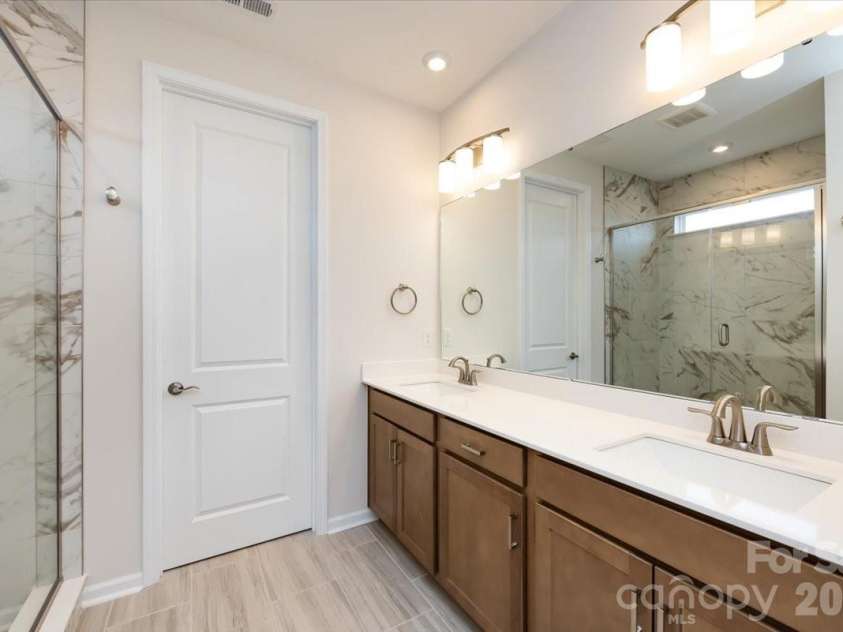 3013 Circles End, Charlotte, NC 28226.  MLS# CAR4396103, YatesRealty ID 42452. Dual vanity primary bathroom