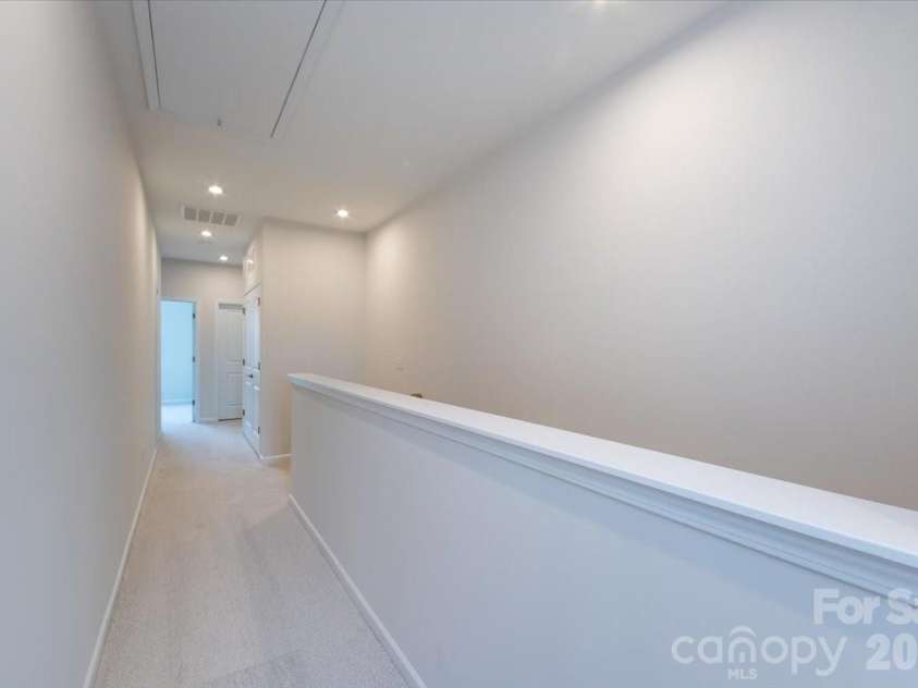 3013 Circles End, Charlotte, NC 28226.  MLS# CAR4396103, YatesRealty ID 42452. Third floor landing and hallway