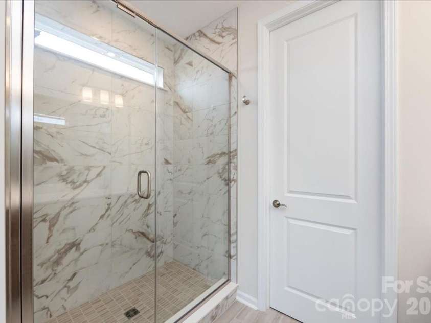3013 Circles End, Charlotte, NC 28226.  MLS# CAR4396103, YatesRealty ID 42452. Tiled primary walk-in shower