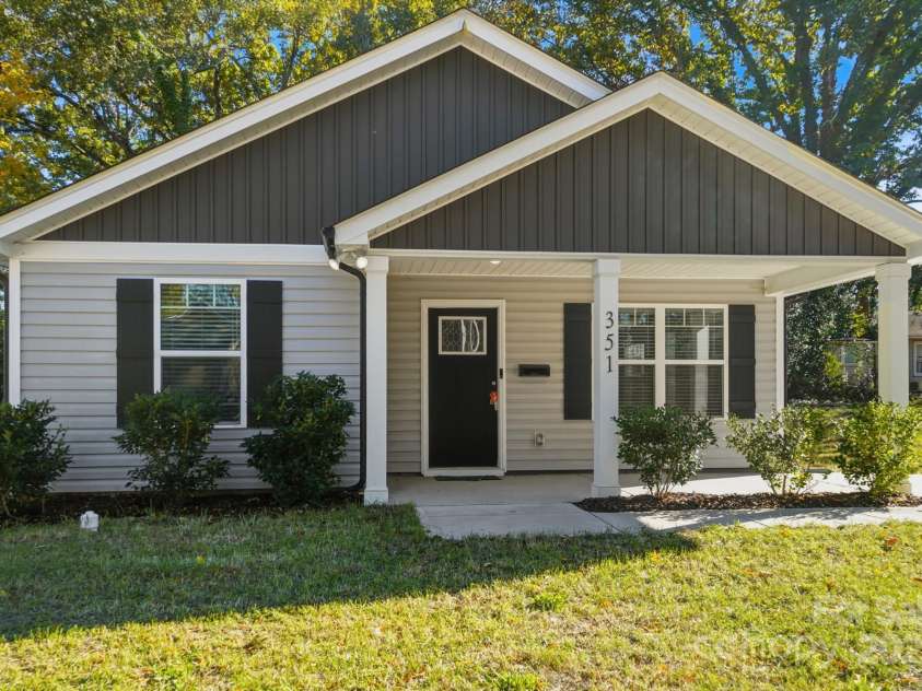 351 Center Street, Kannapolis, NC 28083.  MLS# CAR4304032, YatesRealty ID 4248. A beautifully maintained and recently built home at 351 Center Street in Kannapolis, NC, welcomes you with its charming covered front porch and modern curb appeal