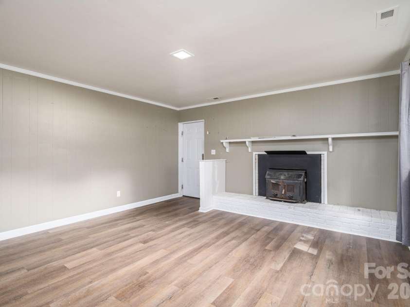 304 Windsor Drive, Shelby, NC 28150.  MLS# CAR4408450, YatesRealty ID 42488. Basement den w/ wood burning fireplace