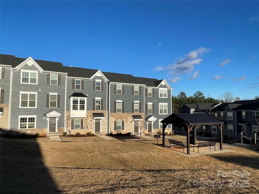 2133 Tupelo Grove Lane, Gastonia, NC 28054.  MLS# CAR4206022, YatesRealty ID 4249. Common area in front of home with picnic shelters and grills