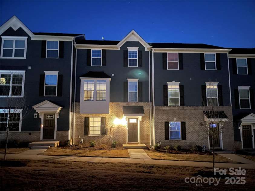 2133 Tupelo Grove Lane, Gastonia, NC 28054.  MLS# CAR4206022, YatesRealty ID 4249. Front door at night