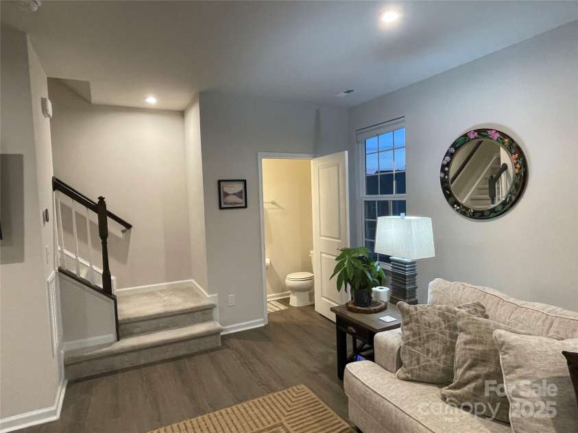 2133 Tupelo Grove Lane, Gastonia, NC 28054.  MLS# CAR4206022, YatesRealty ID 4249. Living room has half bath in the corner by the stairs.