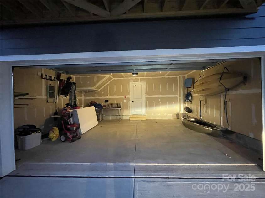 2133 Tupelo Grove Lane, Gastonia, NC 28054.  MLS# CAR4206022, YatesRealty ID 4249. Looking into the 2 car garage. Door at back opens into the lower level bonus room.