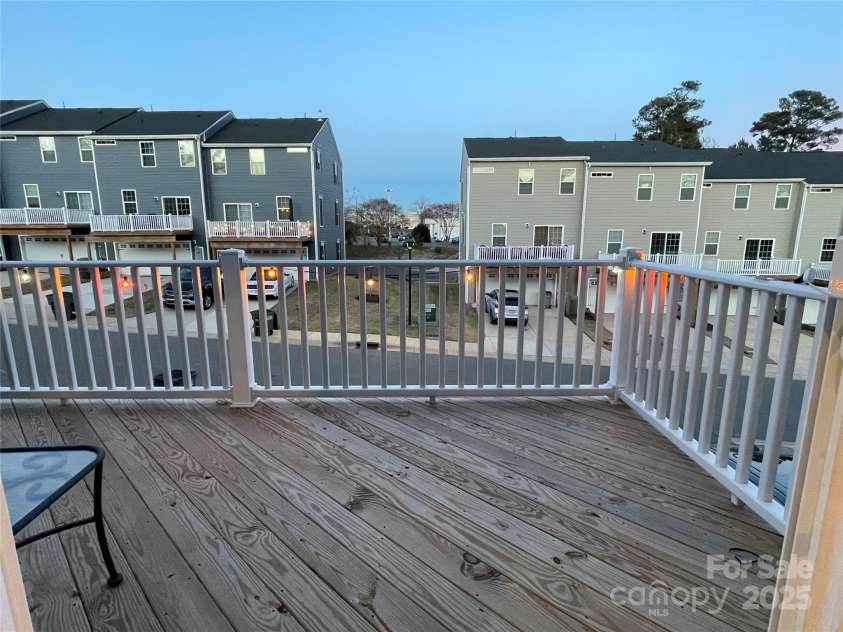 2133 Tupelo Grove Lane, Gastonia, NC 28054.  MLS# CAR4206022, YatesRealty ID 4249. Patio door from kitchen leads to the deck perched over the driveway.