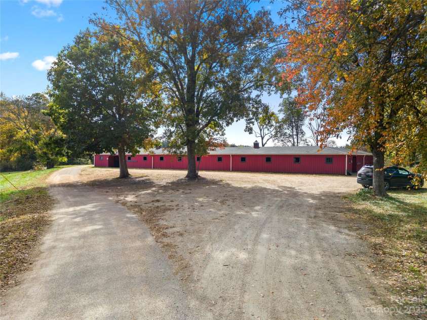1642 Smith Waldrop Road, Mill Spring, NC 28756.  MLS# CAR4089037, YatesRealty ID 425. 24 Stall Barn - Tack, Feed & Wash Stalls