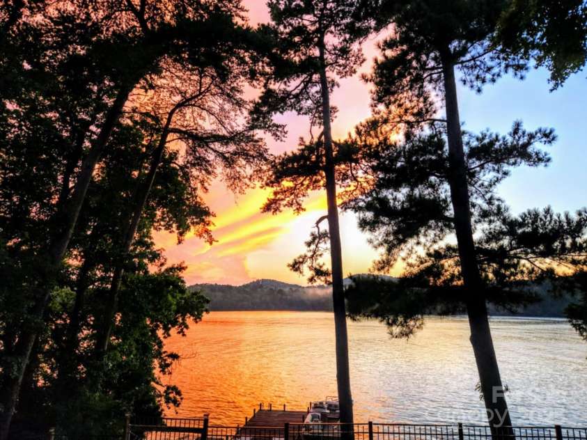 228 Sugar Loaf Drive, Troy, NC 27371.  MLS# CAR4204774, YatesRealty ID 4250. Sunset view provided by Owners