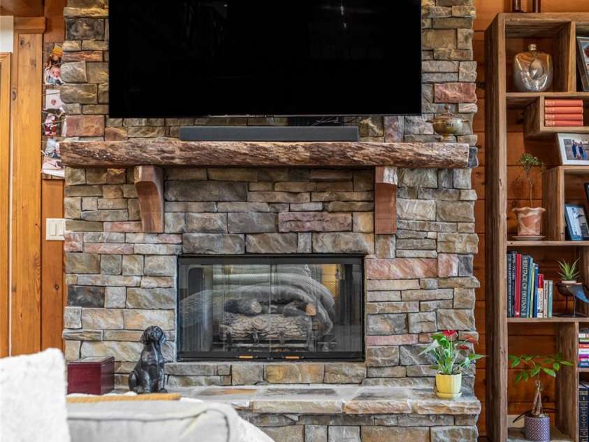 580 Flying Hawk Trail, Waynesville, NC 28786.  MLS# CAR4410856, YatesRealty ID 42522. 2 sided gas burning fireplace