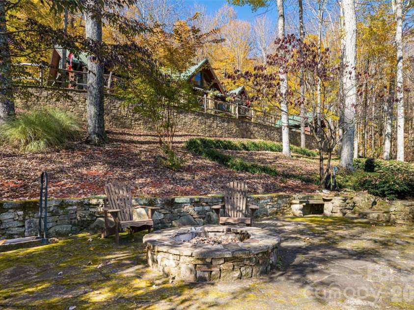 580 Flying Hawk Trail, Waynesville, NC 28786.  MLS# CAR4410856, YatesRealty ID 42522. Firepit area
