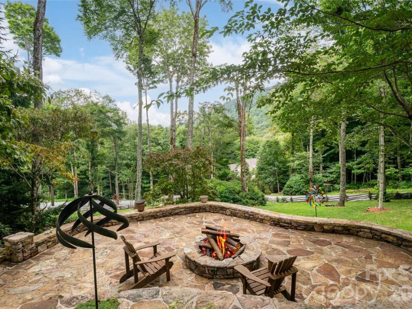 580 Flying Hawk Trail, Waynesville, NC 28786.  MLS# CAR4410856, YatesRealty ID 42522. Firepit area