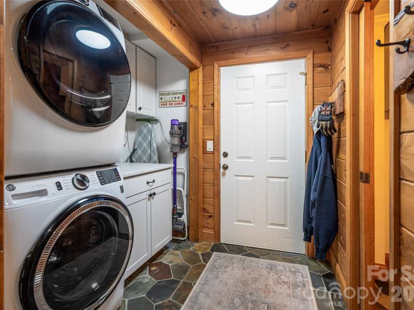 580 Flying Hawk Trail, Waynesville, NC 28786.  MLS# CAR4410856, YatesRealty ID 42522. Laundry on main with new barn door closure