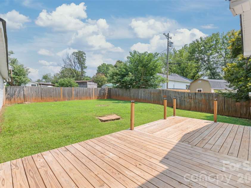 200 Park Avenue, Mount Holly, NC 28120.  MLS# CAR4407165, YatesRealty ID 42529. Back deck looking into fenced backyard - so much space