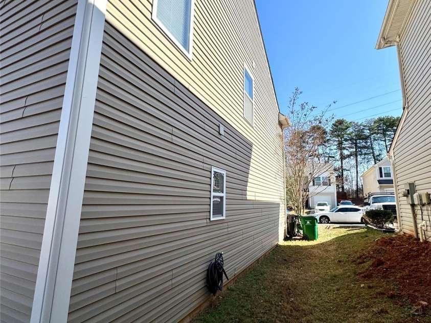 719 Mountain Quail Drive, Charlotte, NC 28216.  MLS# CAR4228004, YatesRealty ID 4253. Front Side Exterior
