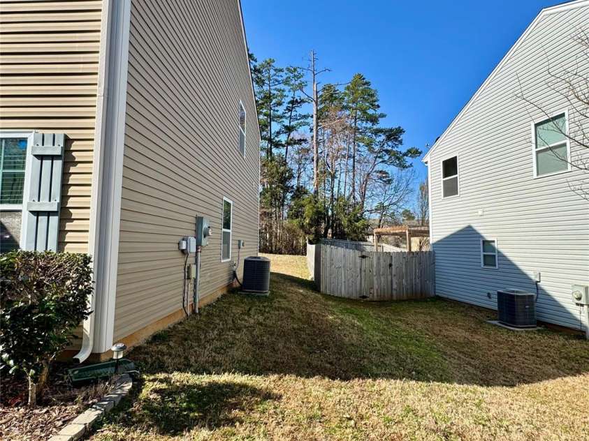 719 Mountain Quail Drive, Charlotte, NC 28216.  MLS# CAR4228004, YatesRealty ID 4253. Side Exterior