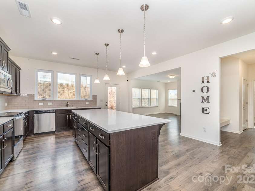2522 Andes Drive, Statesville, NC 28625.  MLS# CAR4238678, YatesRealty ID 4254. Electric Range, Quartz Countertops, Subway Tile Backsplash, Oversized Island, Picture Window over the sink
