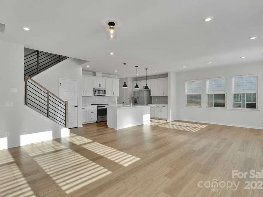 8817 Arrington Hall Drive, Charlotte, NC 28215.  MLS# CAR4312474, YatesRealty ID 42560. Gorgeous Wood Flooring on Main Level & Modern Iron Railing