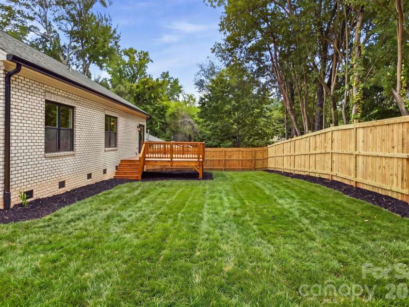 4704 Murrayhill Road, Charlotte, NC 28209.  MLS# CAR4388819, YatesRealty ID 42570. Fully fenced backyard. NOTE: The front lawn has been recently planted with sod, and photography has been digitally enhanced to represent the yard at full, established growth.