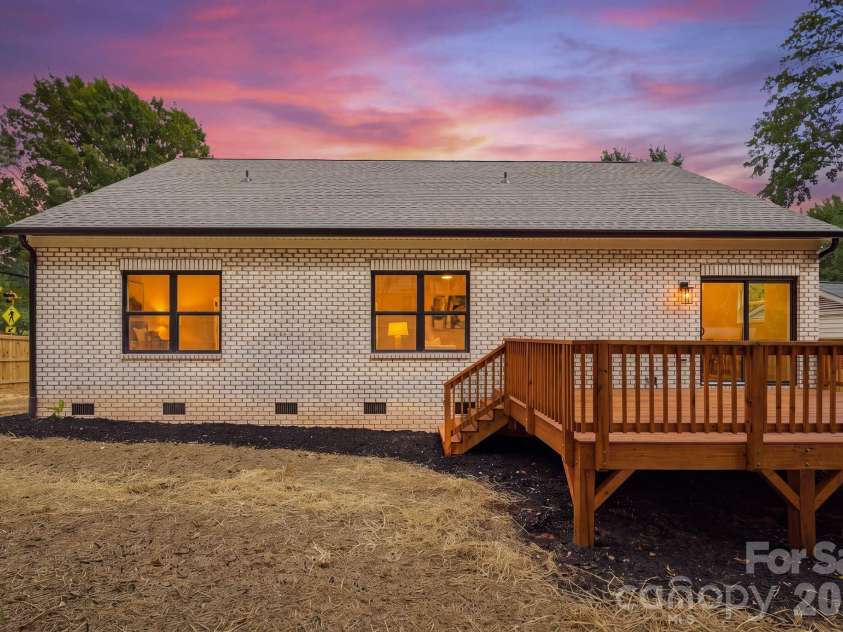 4704 Murrayhill Road, Charlotte, NC 28209.  MLS# CAR4388819, YatesRealty ID 42570. Rear view at twilight.