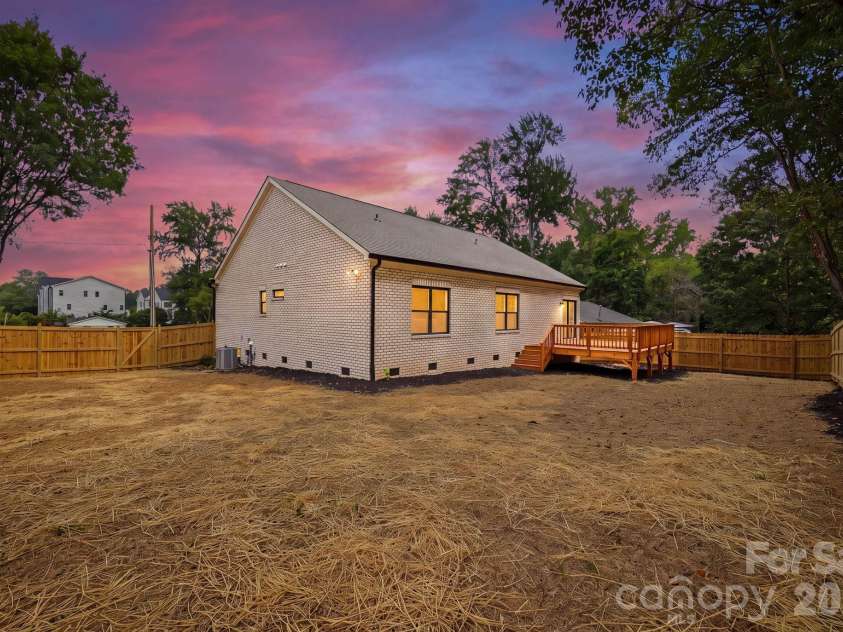 4704 Murrayhill Road, Charlotte, NC 28209.  MLS# CAR4388819, YatesRealty ID 42570. Rear view at twilight.