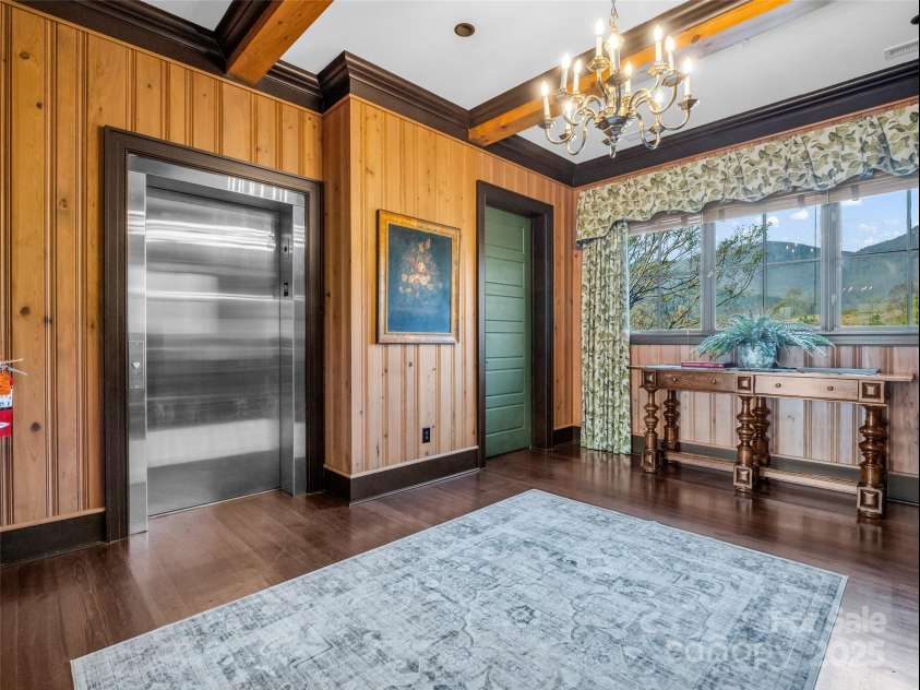 305 Clubhouse Lane, Mill Spring, NC 28756.  MLS# CAR4241690, YatesRealty ID 4258. Seamless entrance from the elevator into a spacious, welcoming foyer