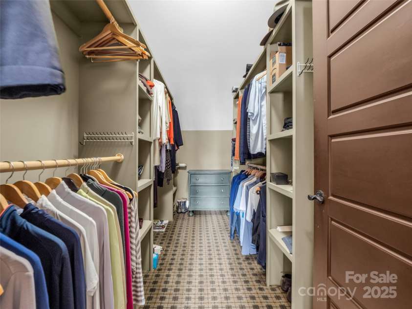 305 Clubhouse Lane, Mill Spring, NC 28756.  MLS# CAR4241690, YatesRealty ID 4258. Spacious primary closet designed for both style and organization