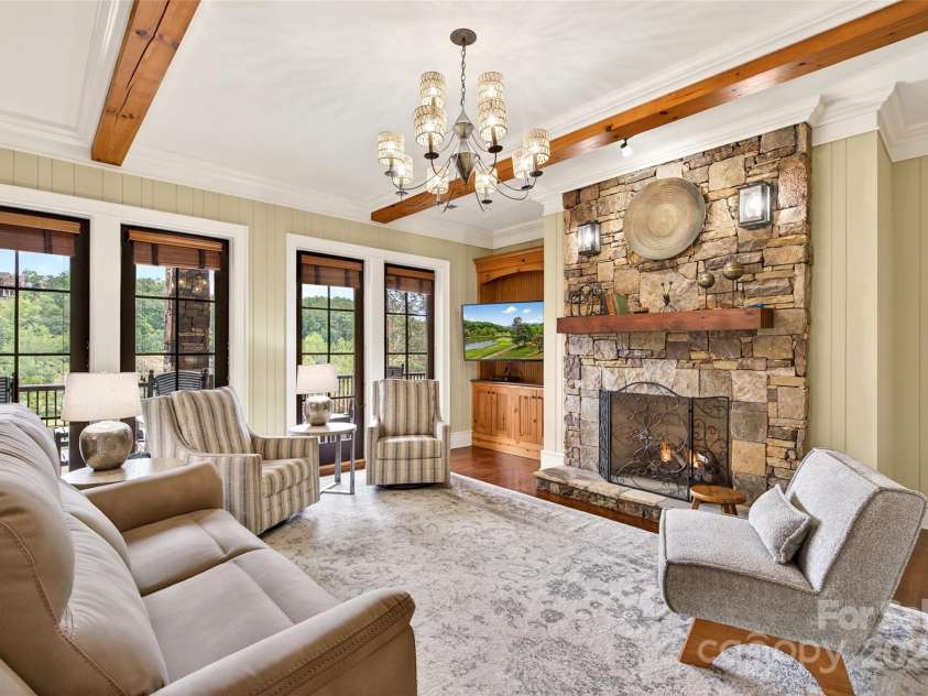 305 Clubhouse Lane, Mill Spring, NC 28756.  MLS# CAR4311469, YatesRealty ID 4258. Stone gas log fireplace