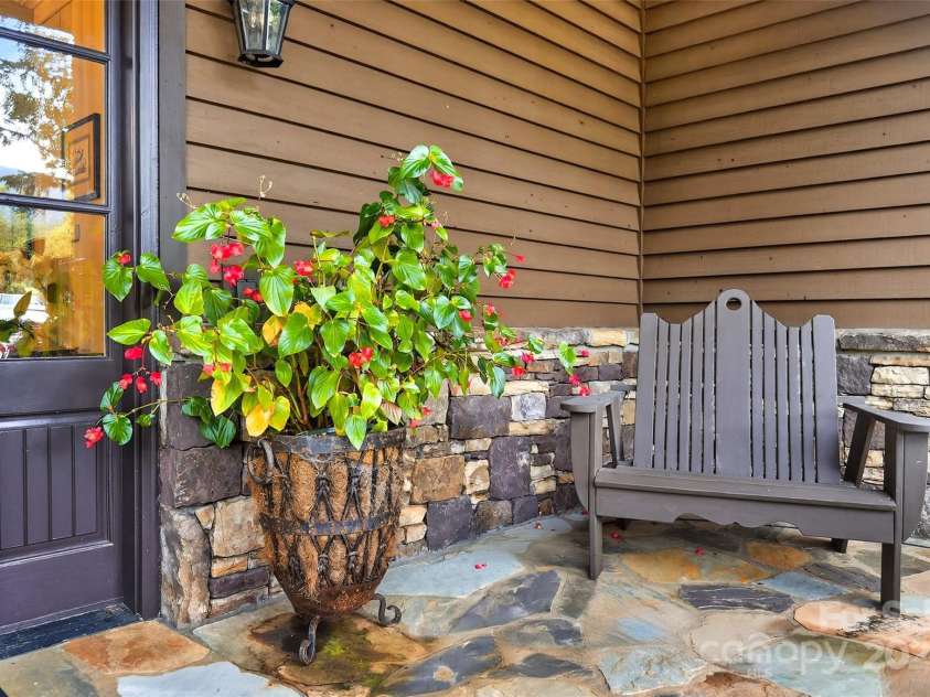 305 Clubhouse Lane, Mill Spring, NC 28756.  MLS# CAR4311469, YatesRealty ID 4258. Welcoming porch to building