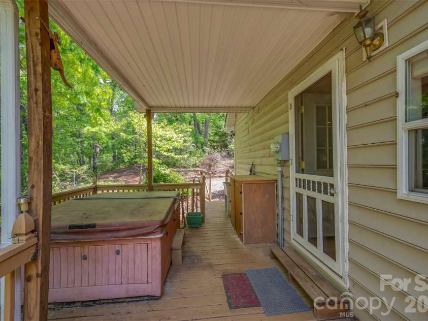 132 Egret Road, Lake Lure, NC 28746.  MLS# CAR4254580, YatesRealty ID 4259. Covered side deck